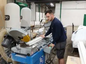 Man working in a factory that manufactures cavity closers